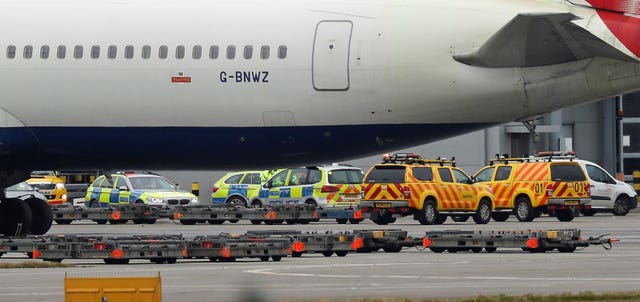 Police and airside operations vehicles at the scene (Steve Parsons/PA)
