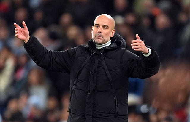 Manchester City manager Pep Guardiola with scratches on his face during a game against Feyenoord