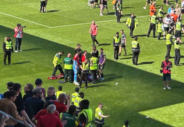 Aberdeen’s Jack MacKenzie receives treatment on the pitch