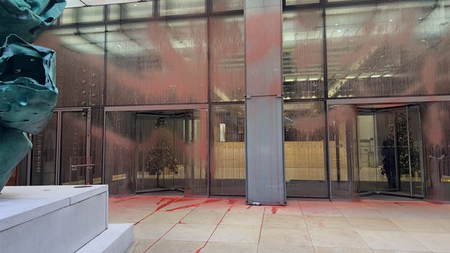 The scene at Aspen Insurance at Plantation Place in the City of London, after two activists sprayed red paint over the front of the building