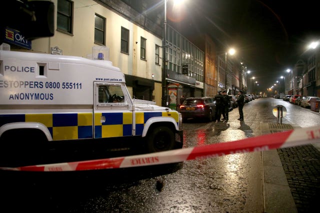 Police near the scene of a suspected car bomb on Bishop Street in Londonderry