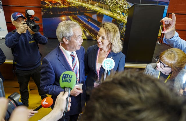 Reform UK’s Sarah Pochin and party leader Nigel Farage speak to the media