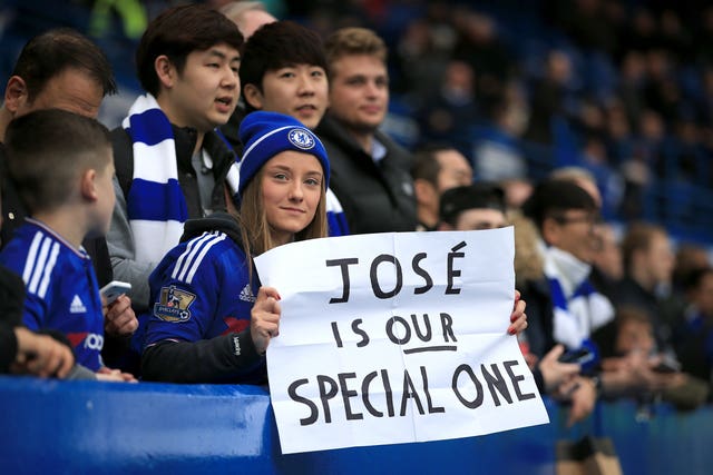 A Chelsea fan shows her support for Jose Mourinho