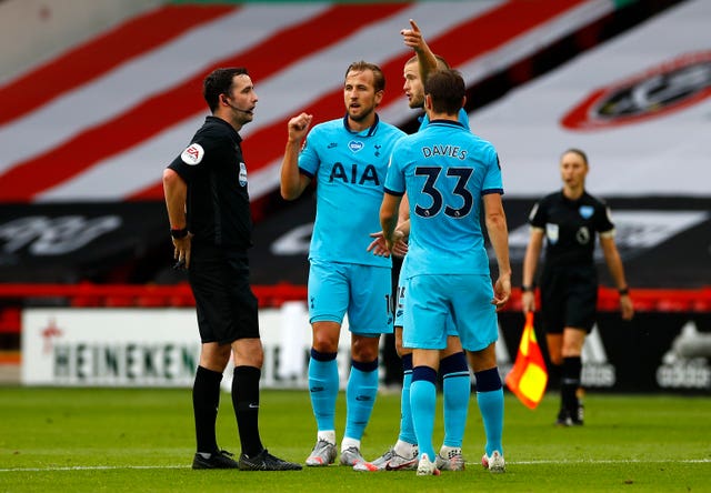 Tottenham''s Harry Kane and Eric Dier speak with match referee Chris Kavanagh at half-time 