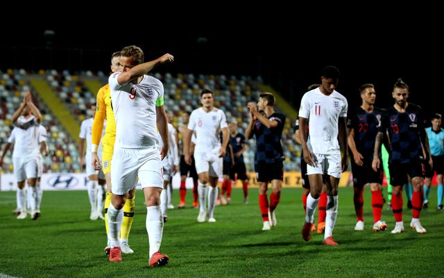 Harry Kane, left, after the final whistle in Croatia 