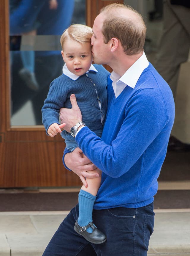 William with his son Prince George as he arrives at the Lindo Wing to see Kate and baby Charlotte (Anthony Devlin/PA)