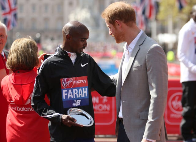 Sir Mo Farah and Prince Harry speak after the race (Paul Harding/PA)