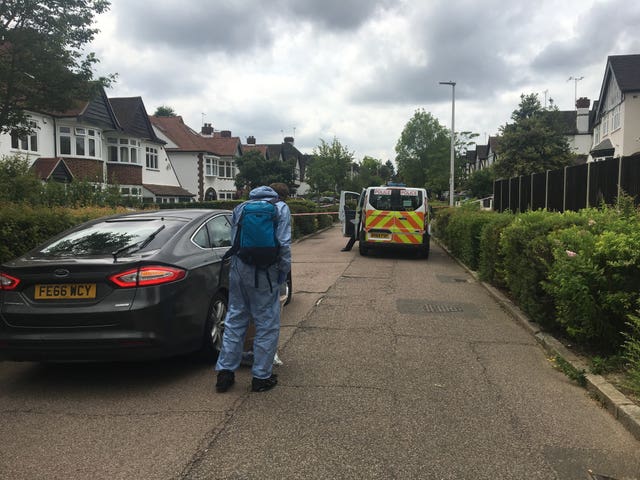 Forensic officers arrive at the scene