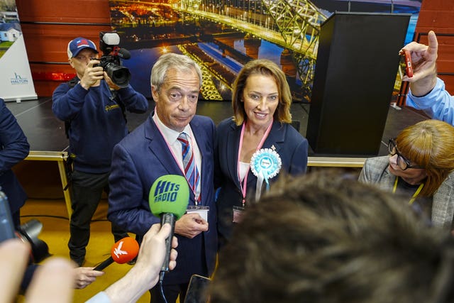 Reform UK’s candidate Sarah Pochin and party leader Nigel Farage speak to the media as they arrive ahead of the result