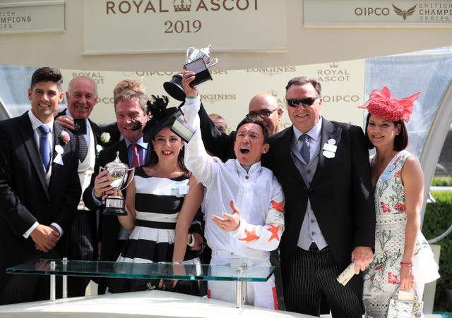 Frankie Dettori celebrates with winning connections of Advertise