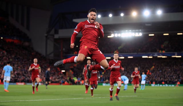 Alex Oxlade-Chamberlain celebrates scoring Liverpool's second in their 3-0 Champions League quarter-final first leg win over City last season