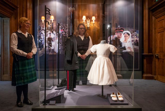 The wedding outfits worn by Prince George and Princess Charlotte in an exhibition at the Palace of Holyroodhouse, Edinburgh