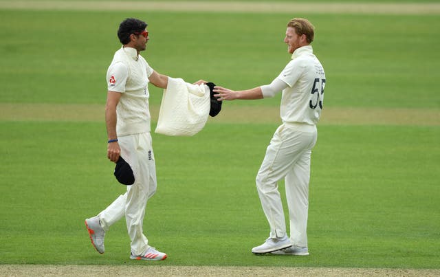 James Anderson gives his jumper to captain Ben Stokes