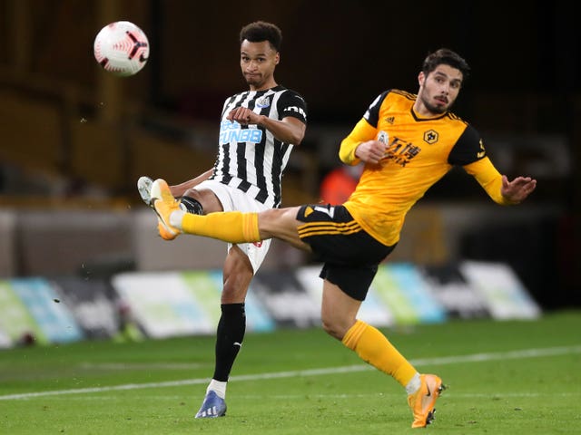 Jacob Murphy, left, and Wolves’ Pedro Neto battle for the ball