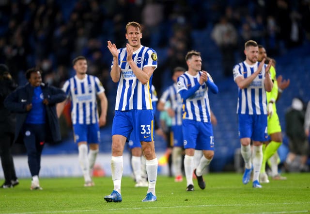 Dan Burn celebrates Brighton''s win