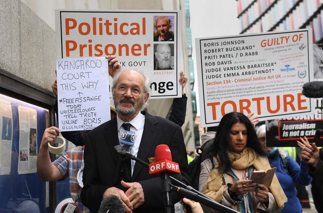 John Shipton, the father of WikiLeaks founder Julian Assange, speaks outside court