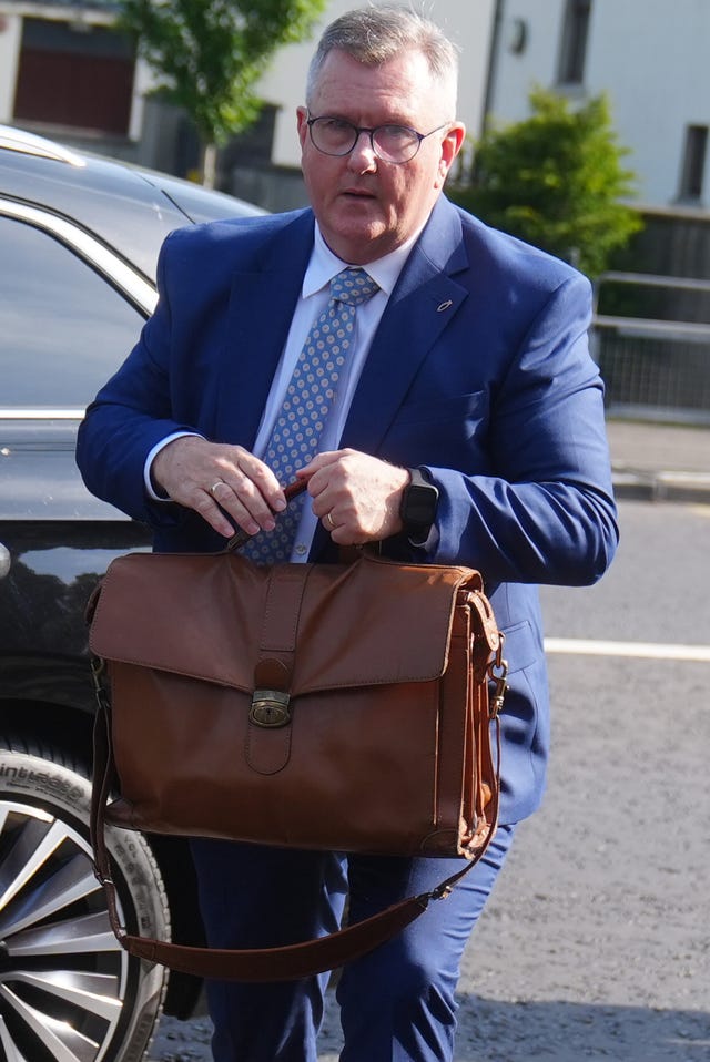 Jeffrey Donaldson outside Newry Crown Court holding a briefcase