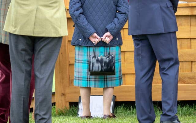 The Queen with her trusty hand bag (Steve Parsons/PA)