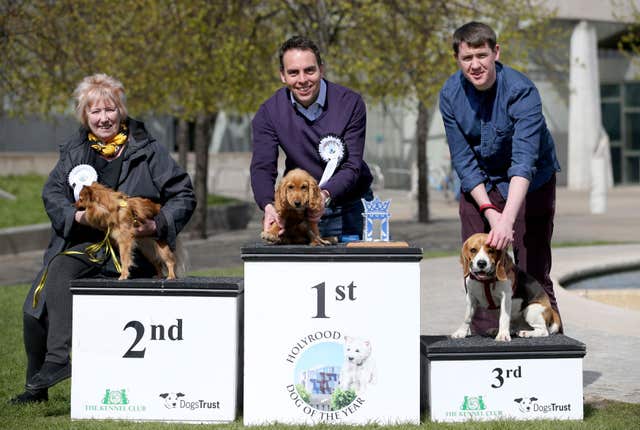(Left to right) Christine Grahame MSP with her dog Chloe, Maurice Golden MSP with his dog Leo and Mark Griffin MSP with Alfie (Jane Barlow/PA)