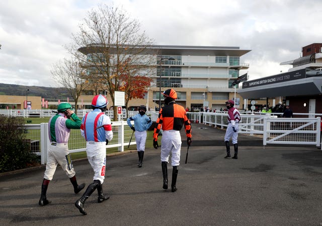 Jockeys make their way out to the paddock at Cheltenham