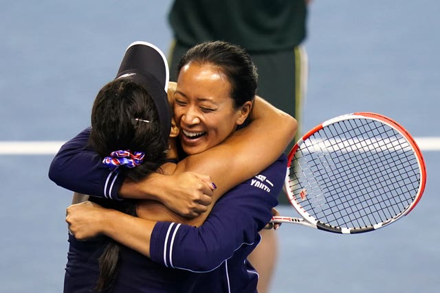 Heather Watson celebrates her victory with captain Anne Keothavong