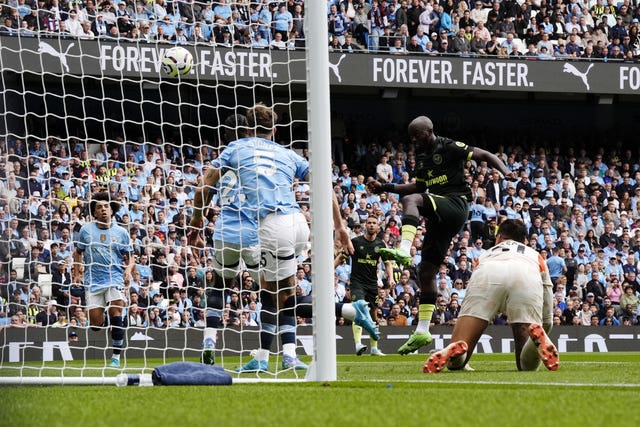 Brentford's Yoane Wissa heads the opening goal against Manchester City on Saturday