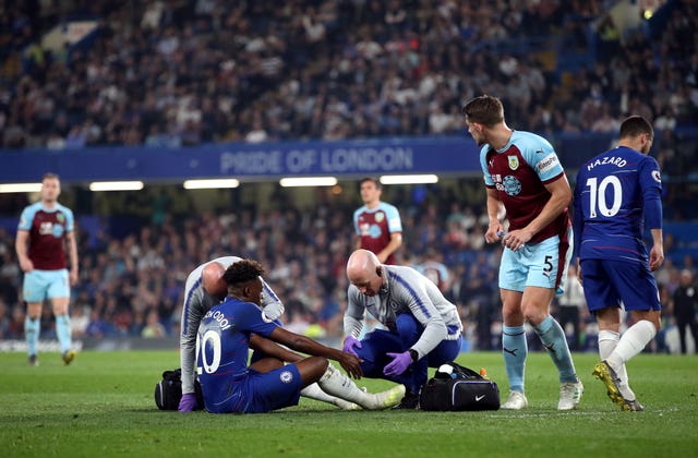 Callum Hudson-Odoi receives treatment after his injury against Burnley