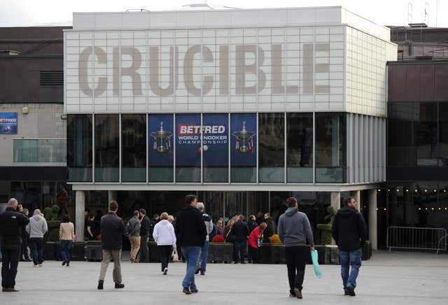 Snooker fans arrive at the Crucible Theatre