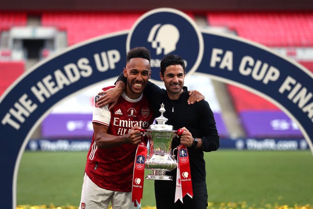 Arsenal's Pierre-Emerick Aubameyang (left) and manager Mikel Arteta celebrate their FA Cup final victory at Wembley