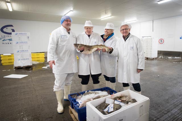 Prime Minister Boris Johnson during a visit to Grimsby Fish Market