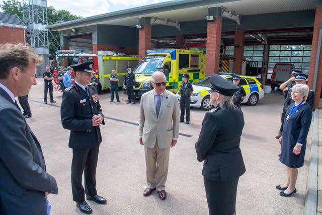 Charles talks to a police officer (Paul Grover/Daily Telegraph/PA)