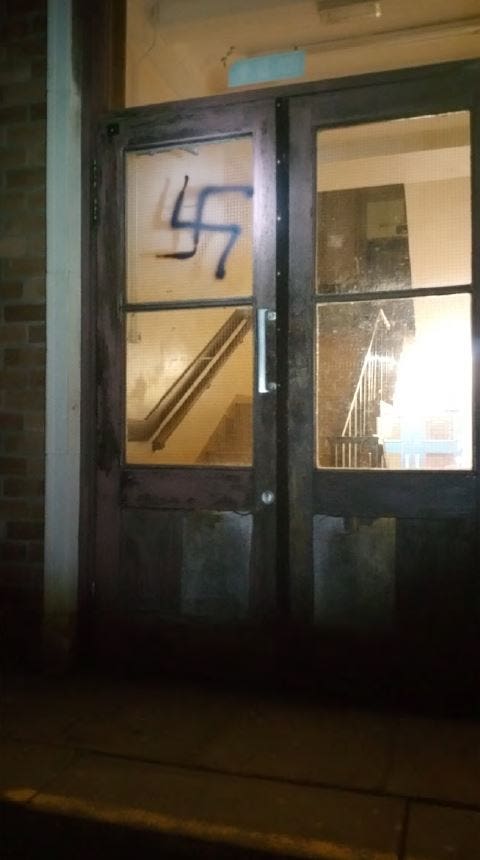 A swastika spray painted on a door in Newport, south Wales by Austin Ross