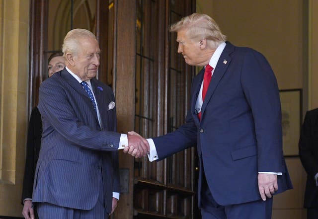 The King shakes hand with President Trump at the end of his stay in Windsor Castle