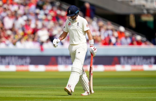 Joe Root walks off after being dismissed
