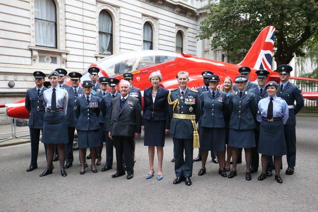 Prime Minister Theresa May stands with members of the RAF in Downing Street (Jonathan Brady/PA)
