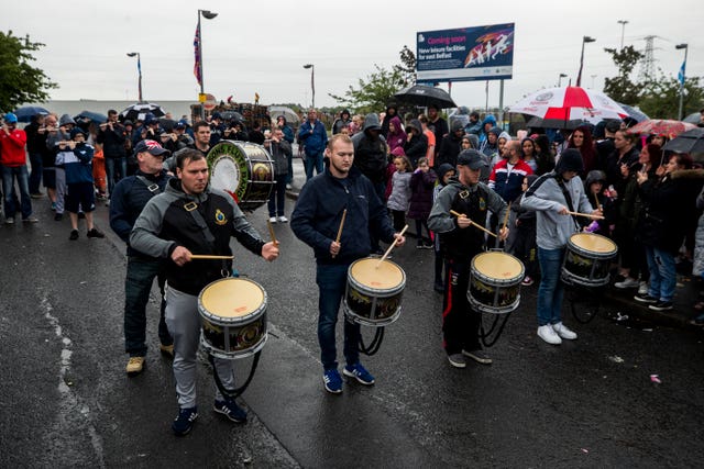 Bandsmen from the Rising Sons Flute Band outside Avoniel Leisure Centre