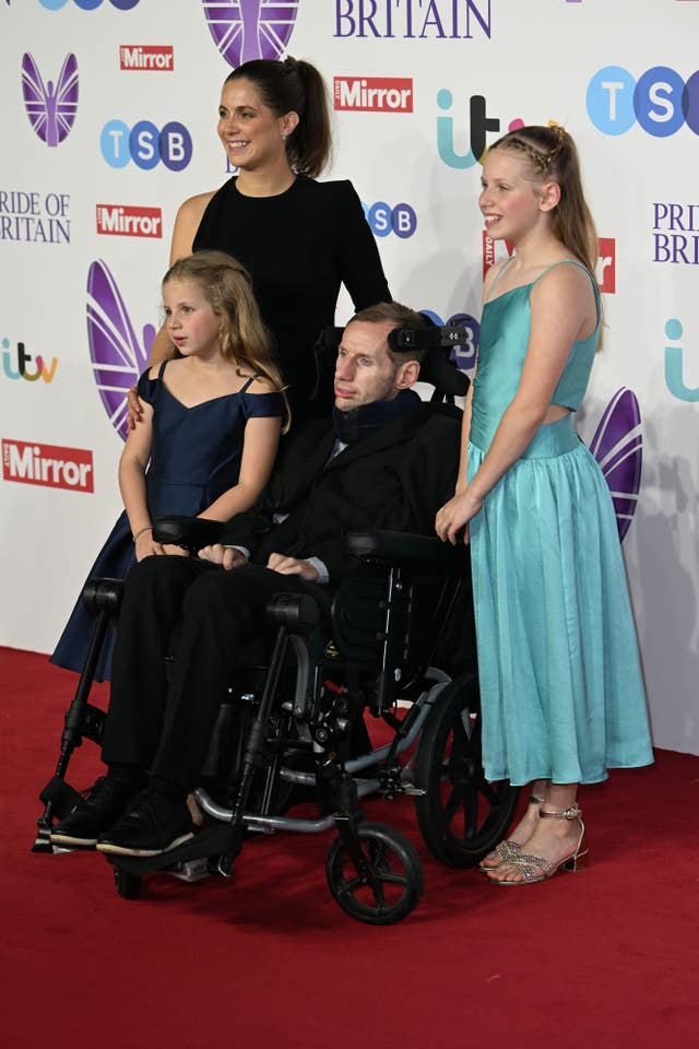 Lindsey Burrow, Rob Burrow, Maya Burrow and Macy Burrow in front of Pride of Britain Awards backdrop
