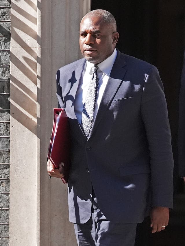 Foreign Secretary David Lammy walks with a folder under his arm