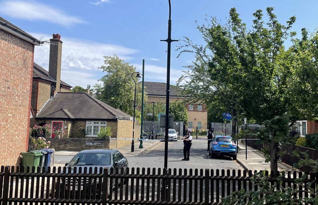 Police at the scene in Ealing, west London