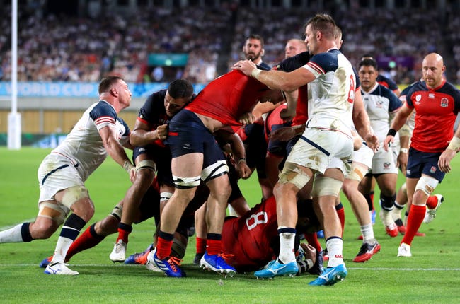 England’s Billy Vunipola, bottom, scores his side's second try
