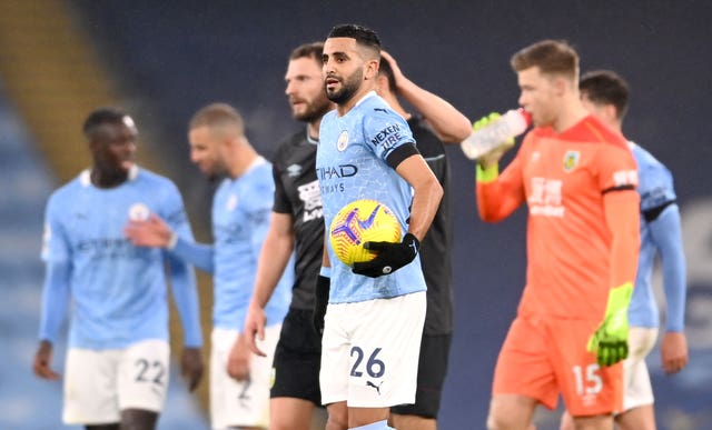 Riyad Mahrez leaves with the match ball