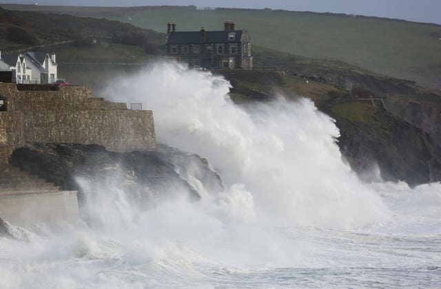 Crashing waves blown by heavy winds