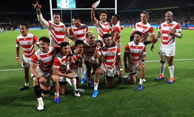 Japan's players celebrate their famous victory over Ireland