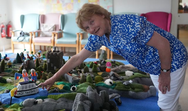 Mary Blake points to a boat in memory of Margaret Dowse who died during the creation of her group’s knitted map of Ireland in Carnew Community Care Centre in Carnew, Co Wicklow