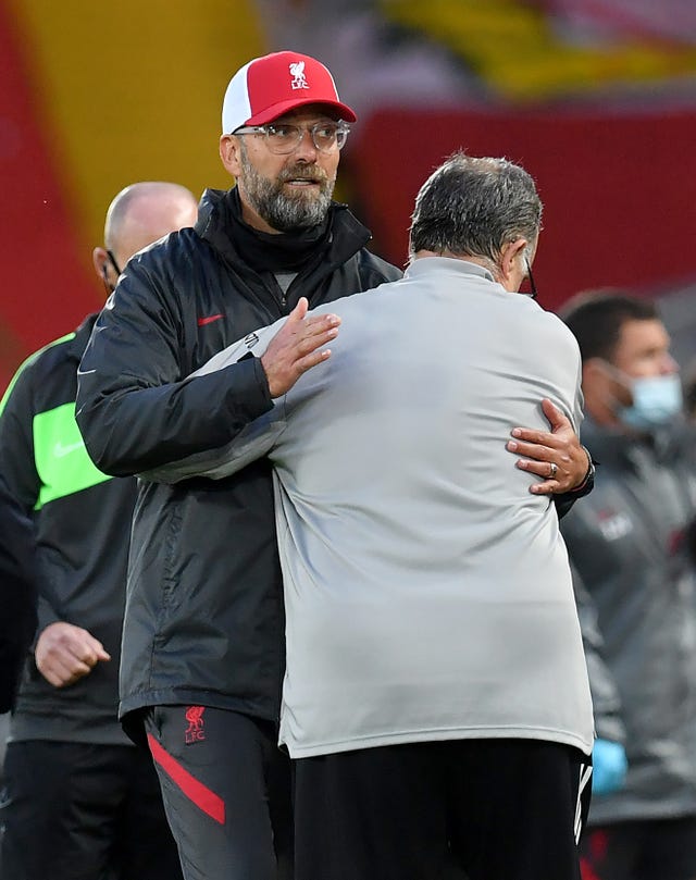 Liverpool manager Jurgen Klopp (left) knew it would be tough against Marcelo Bielsa's Leeds 