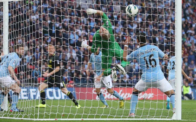 Ben Watson's injury-time header sent Wigan in to FA Cup ecstasy