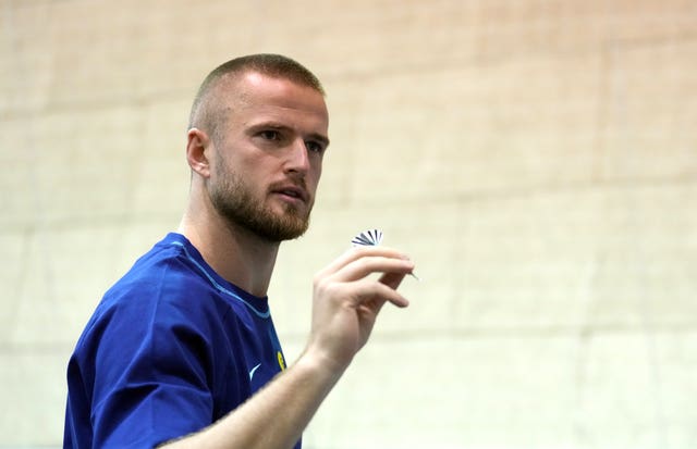 England’s Eric Dier playing darts against a member of the media