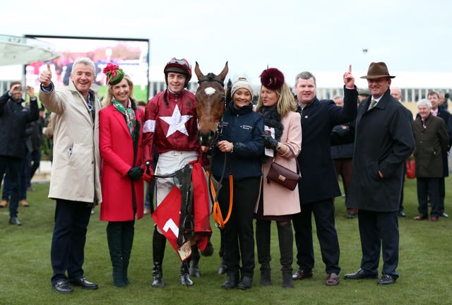 Tiger Roll's connections celebrate after the nine-year-old's win in the Glenfarclas Chase