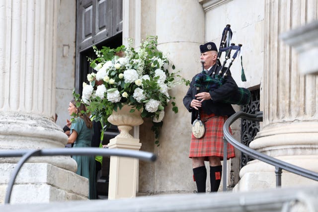 A piper plays at the wedding of Spice Girl Melanie Brown, Mel B, to fiance hairdresser Rory McPhee at St Paul’s Cathedral, London