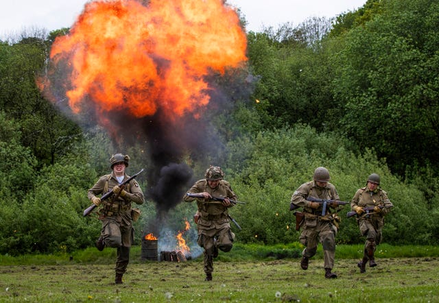 Members of the North west 101st Airborne takes part in a battle re-enactment during the Haworth 40s weekend